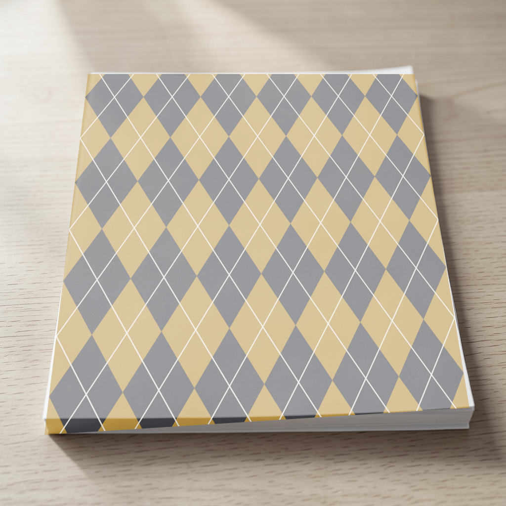 The Charcoal & Gold argyle pattern shown at realistic scale in a pages scene